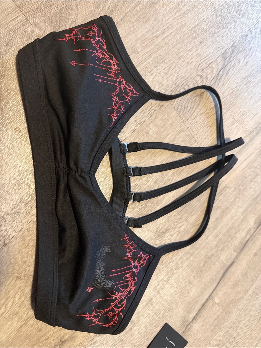 Black Strappy Sports Bra with Red Graphic Detail